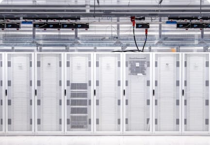 Design phase of CUDO's delivery process, showing a photo of a deployed cluster